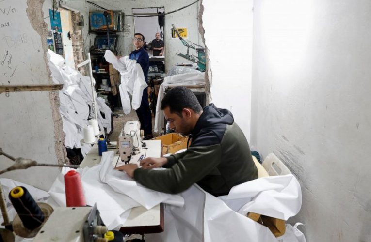 Gaza factories roar back to life to make protective wear