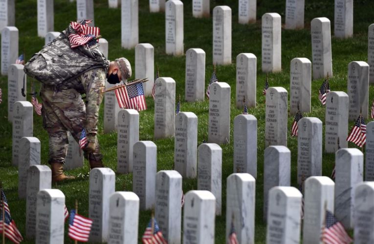 Solemn rituals remain but with new precautions at Arlington National Cemetery this Memorial Day