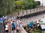 Moment boy PUSHES older man into a canal