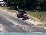 Driver struggles to reverse jet ski trailer down a boat ramp leaving onlookers in fits of laughter 