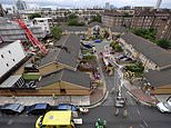 Woman, 85, who died when 65ft crane collapsed onto her home in east London is buried beneath rubble