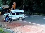 Indian motorcyclist avoids being crushed as digger hits Jeep 