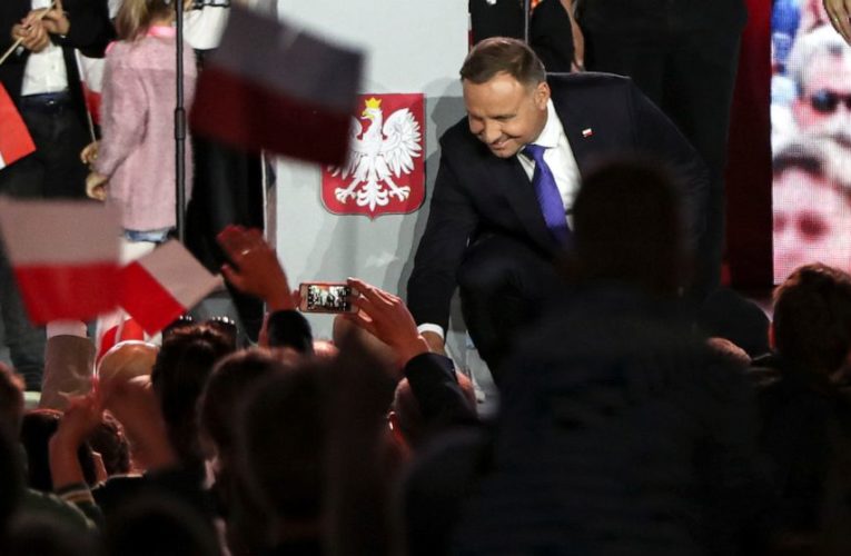 Conservative Polish president wins 2nd term after tight race