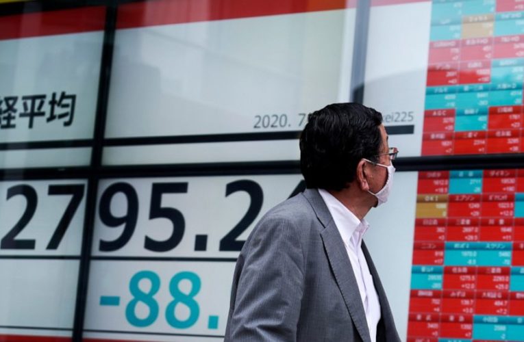 Asian shares turn lower as virus caseloads surge