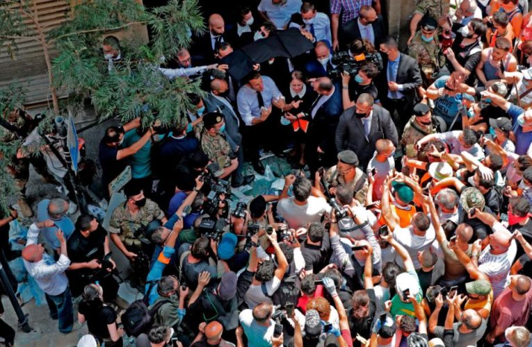 French President Emmanuel Macron toured a neighborhood devastated by Tuesday’s massive explosion and was swarmed by large crowds