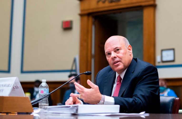 The postmaster general clashed with a Democratic lawmaker over plans to remove hundreds of high-volume mail-processing machines