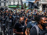 Hundreds of protesters aiming to ‘lock down’ Brixton march down London streets