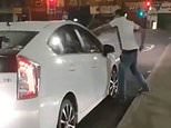 Shocking moment raging ‘Uber’ driver smashes ‘rival’s’ car windows after minor crash