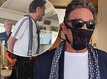 John McAfee claims he’s been arrested in Norway for wearing lacy THONG on his face instead of mask 