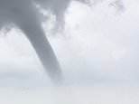 Huge spinning waterspout looms over the Bristol Channel as storms batter Britain