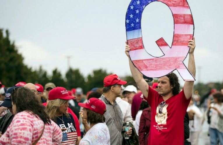 Facebook bans some, but not all, QAnon groups, accounts