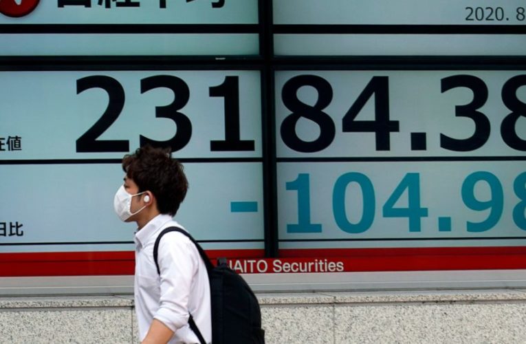 World markets edge up, Japanese stocks fall on economic data