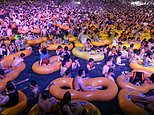Thousands of Wuhan revellers cram into a water park at the former COVID-19 epicentre