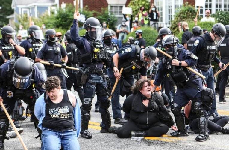 One ex-officer, Brett Hankison, faces a charge related to firing into her home. Demonstrators take to the streets.