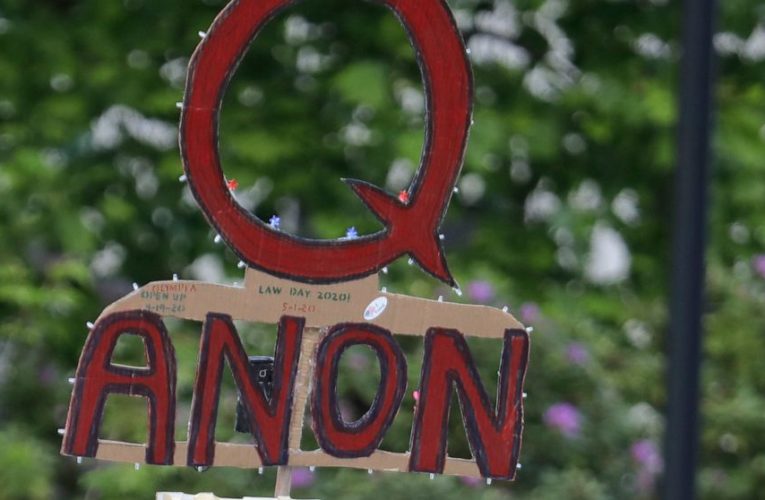 Facebook says it will ban groups that openly support QAnon