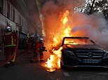 Rioting erupts in French cities after police use tear gas and batons to break up crowds