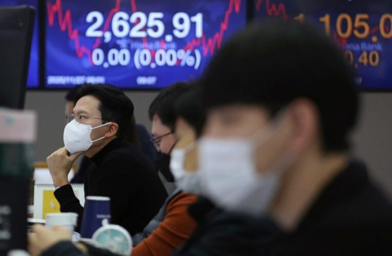 Global stocks mixed amid unease about vaccine development