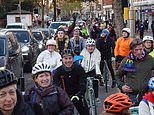 Cyclists with Extinction Rebellion flags protest removal of hated cycle lane