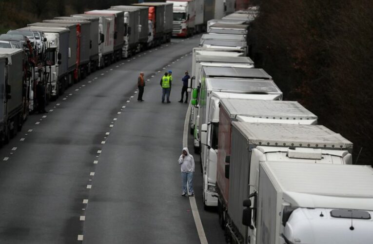 Virus-linked isolation of UK eases but backlog persists