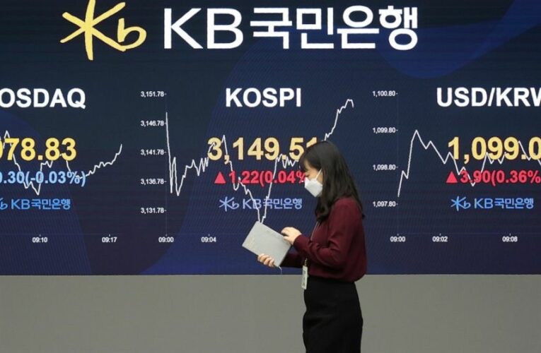 Asian shares mixed as traders await details of Biden plan