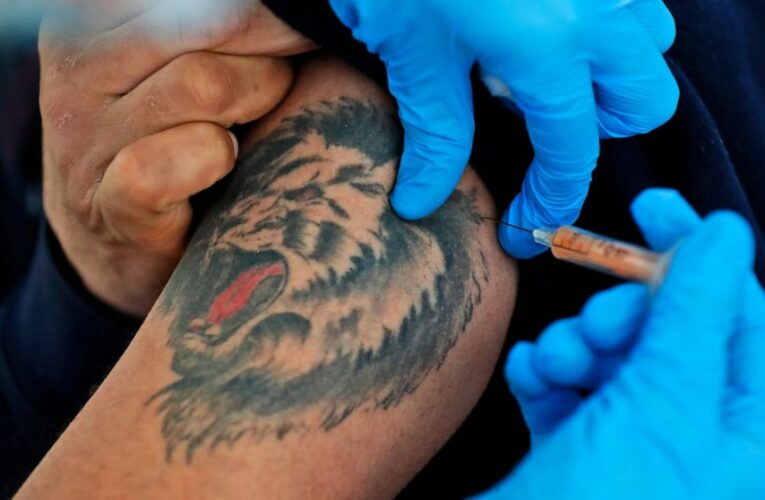 The Latest: Fauci: Virus shot categories to open up by April
