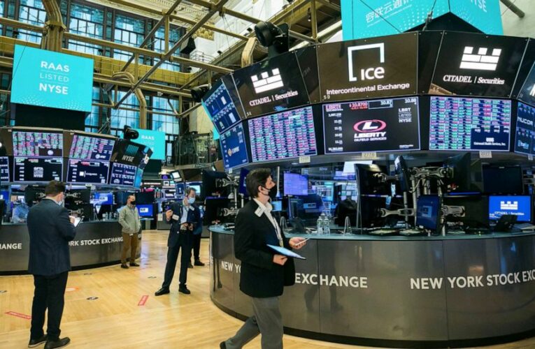 US stock indexes edge higher, hover near all-time highs