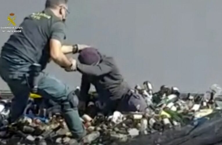 Europe-bound migrants found amid broken glass, toxic ash