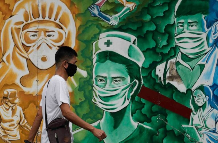 The Latest: Sanofi to produce 12M vaccines for rival company