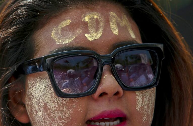Pro-military marchers in Myanmar attack anti-coup protesters