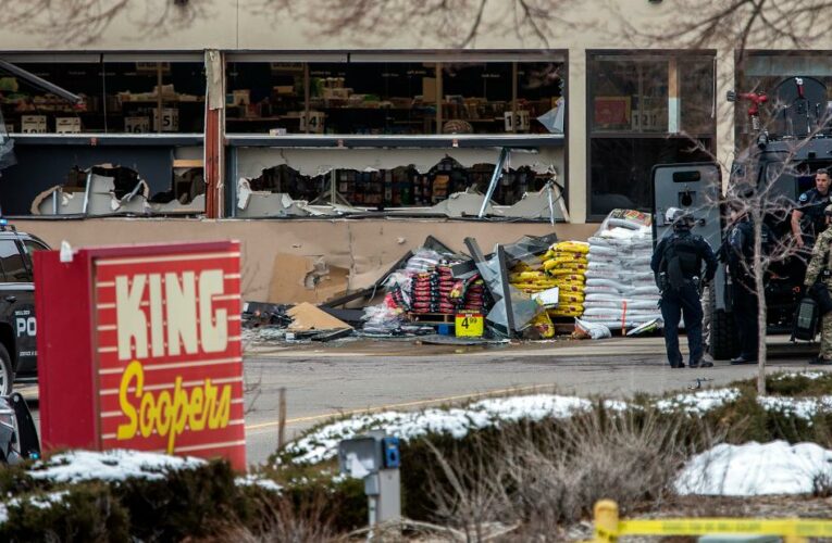 Video taken by an eyewitness appears to show people lying on the ground inside and outside the store and purported gunshots are heard