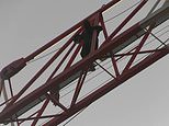 Protestor scales massive building crane to unfurl Black Lives Matter banner in east London