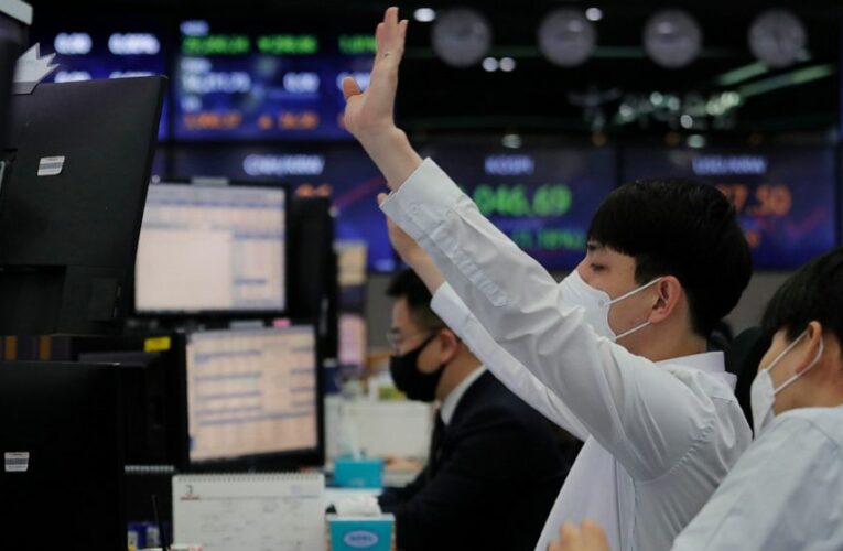 Shares slip in Asia after bond yield spike hits Wall St