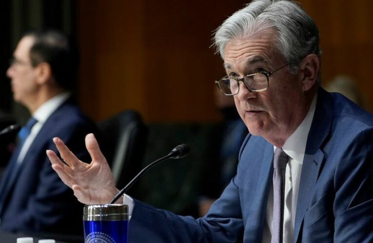 Powell says economy recovering but Fed support still needed