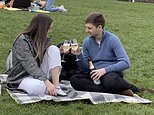 Crowds of lockdown-weary Britons hit parks and beaches despite temperatures continuing to drop