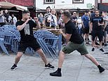 Chelsea and Man City supporters clash in Porto as riot police threaten warring fans with batons