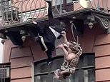 Terrifying moment couple plunge from second-floor balcony ‘during argument’ in Russia