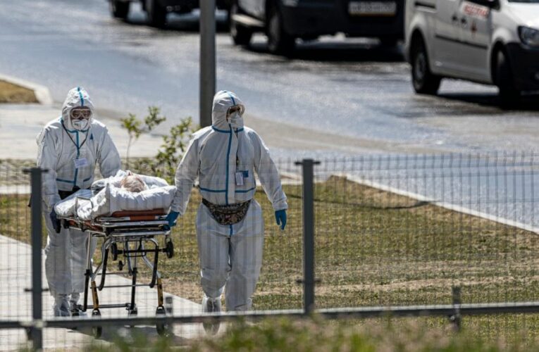 The Latest: Russia reports highest virus death toll of 2021