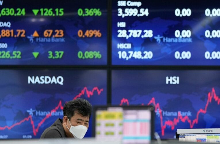 Asian shares edge lower after mixed finish on Wall Street