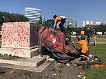 Angry protestors topple and deface statues of Queen and her great-great-grandmother Victoria
