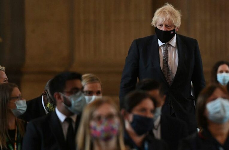 Johnson says restrictions to ease, UK must live with virus
