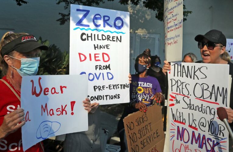 The vote sets up a showdown with Gov. Ron DeSantis, who issued an executive order leaving masks up to parents, not schools