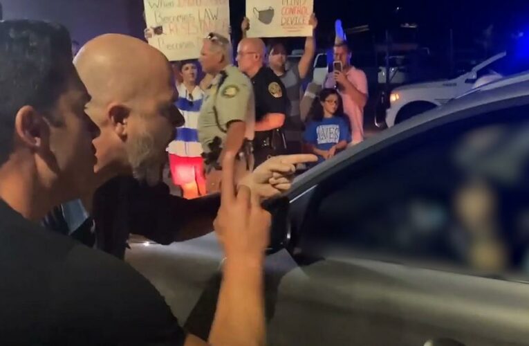 Outraged protesters harass parent outside school board mask vote
