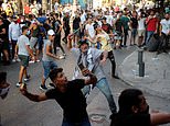 Protesters clash with police during march to mark a year since Beirut port blast