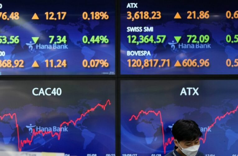 Stocks are mixed on Wall Street as traders wait for the Fed