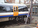 Two people are injured after train crashes through buffers at rush hour in north London 