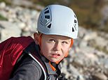 High, dad! Moment seven-year-old boy joins his father as they scale 3,349ft Scottish Munro