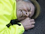 ‘It wasn’t one of my better moves’: Eco-zealot winces in pain after gluing his FACE to the tarmac