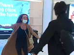 Australians hug at Sydney Airport as quarantine scrapped and international flights resume