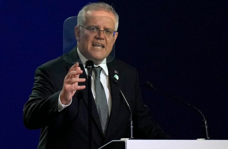 The Latest: Japan PM promises strong push for emission cuts