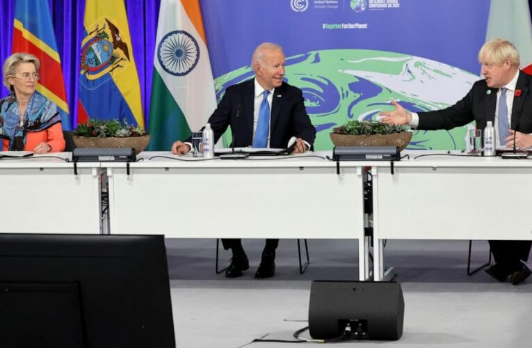 The Latest: Biden hails climate progress, criticizes China